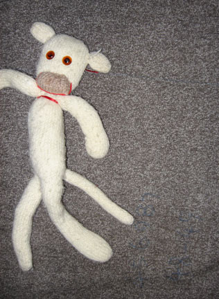 albino sock monkey running